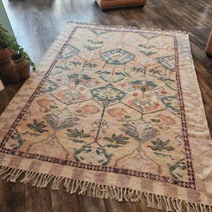 Gorgeous old world rug muted colors. Gently loved by Urban Outfitters